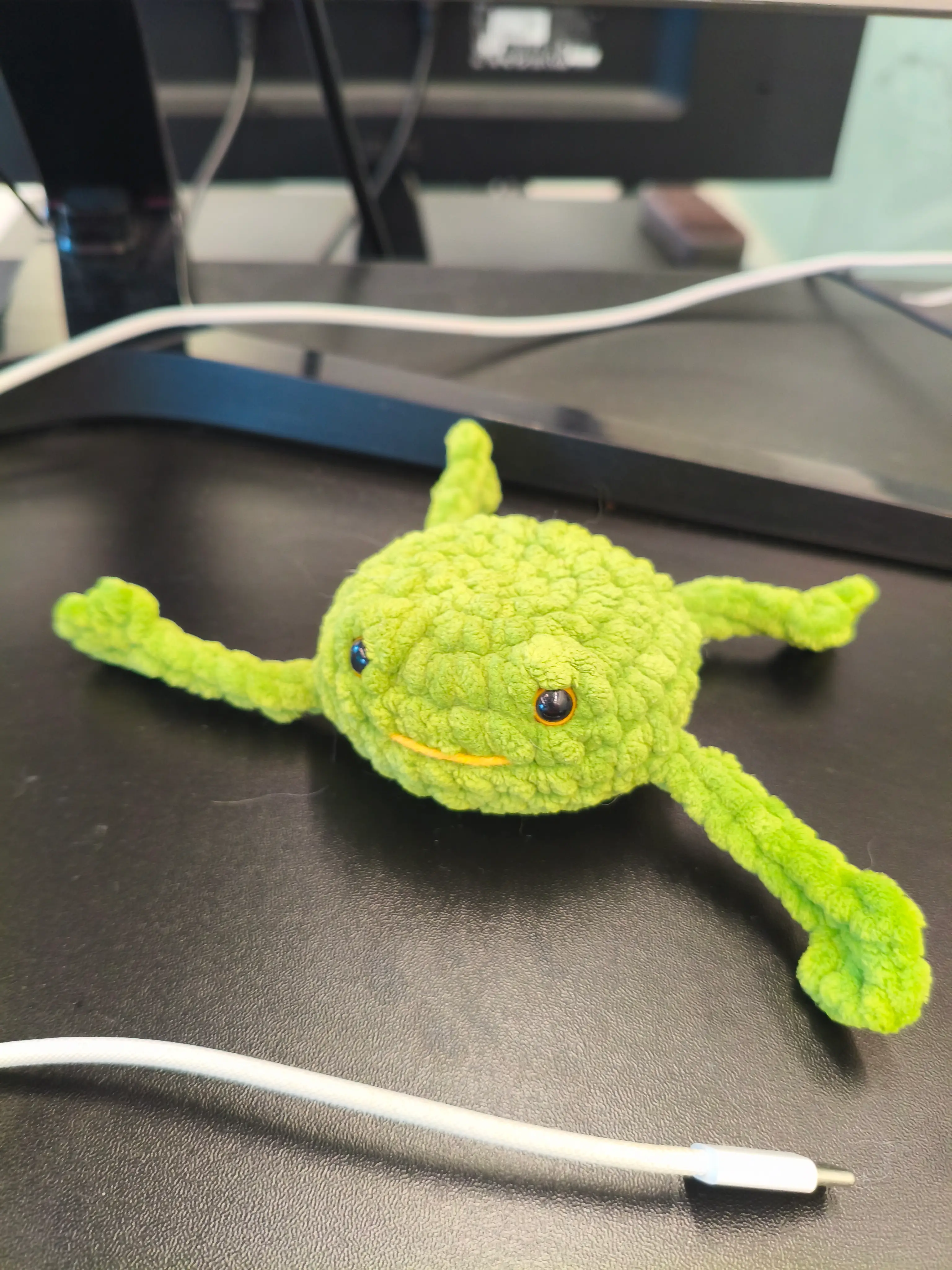 Cute knit frog I put on my office desk
